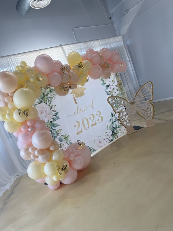 Pastel Class of 2023 graduation backdrop with butterfly cutout