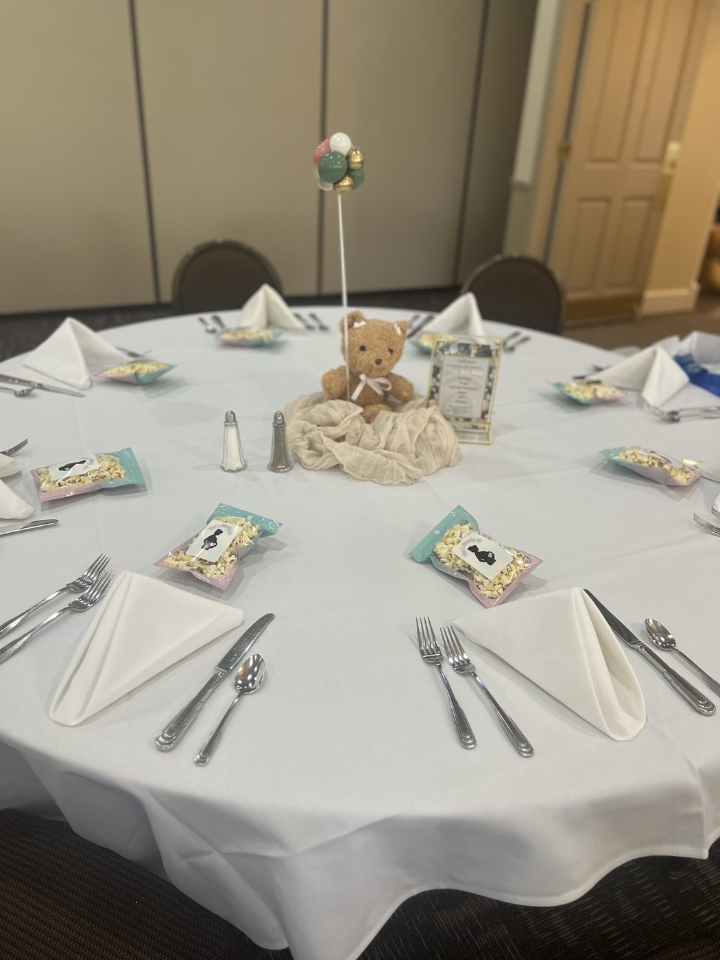 Baby shower tablescape with teddy bear centerpiece